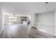 Open living space showcasing the modern kitchen, staircase, and spacious layout at 8629 Ensworth St # 111, Las Vegas, NV 89123