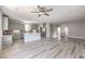 Open-concept living space featuring a modern kitchen and spacious living area at 8629 Ensworth St # 111, Las Vegas, NV 89123