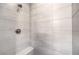 Tiled shower with a built-in bench and a shower head at 8629 Ensworth St # 111, Las Vegas, NV 89123