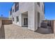 A gravel backyard featuring a sliding glass door to the home's interior at 8629 Ensworth St # 112, Las Vegas, NV 89123