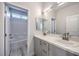 Well-lit bathroom with double vanity, tub and shower combo at 8629 Ensworth St # 112, Las Vegas, NV 89123