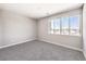 Neutral bedroom with carpeted floors featuring a bright window with an incredible view at 8629 Ensworth St # 112, Las Vegas, NV 89123