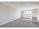 Spacious bedroom with carpet flooring and large windows at 8629 Ensworth St # 112, Las Vegas, NV 89123