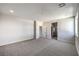 Spacious primary bedroom features neutral carpeting and a walk-in closet at 8629 Ensworth St # 112, Las Vegas, NV 89123