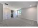 Carpeted bedroom with natural light, and ensuite bathroom access at 8629 Ensworth St # 112, Las Vegas, NV 89123