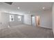 Spacious bonus room with carpet, natural light from windows, and an open layout at 8629 Ensworth St # 112, Las Vegas, NV 89123