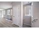 Hallway features modern railing and wood-look floors, connecting different areas of the home at 8629 Ensworth St # 112, Las Vegas, NV 89123