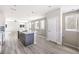 Bright kitchen showcases island with sink and pendant lights at 8629 Ensworth St # 112, Las Vegas, NV 89123