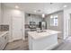 Bright kitchen with an island, pendant lighting, stainless appliances, and gray shaker cabinets at 8629 Ensworth St # 112, Las Vegas, NV 89123