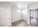 Functional laundry room space featuring wood-look floors, utility hookups, and a convenient doorway at 8629 Ensworth St # 112, Las Vegas, NV 89123