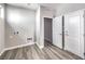 Clean laundry area with wood-look flooring and utility connections for appliances at 8629 Ensworth St # 112, Las Vegas, NV 89123