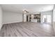 Bright, open-concept area featuring a living room, kitchen, and sliding glass doors to the patio at 8629 Ensworth St # 112, Las Vegas, NV 89123
