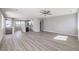 Spacious living room connects to kitchen with wood floors at 8629 Ensworth St # 112, Las Vegas, NV 89123