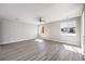 Bright, open floor plan showcases wood floors and ceiling fan at 8629 Ensworth St # 112, Las Vegas, NV 89123
