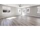 Open living room features wood flooring and ample natural light at 8629 Ensworth St # 112, Las Vegas, NV 89123