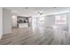 Expansive open-concept floor plan with a kitchen, living room, and abundant natural light at 8629 Ensworth St # 112, Las Vegas, NV 89123