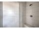 Modern shower featuring large format tile and a built-in seat at 8629 Ensworth St # 112, Las Vegas, NV 89123