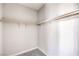 Bright walk-in closet features clean white walls, neutral carpet, and rod and bracket shelving at 8629 Ensworth St # 112, Las Vegas, NV 89123
