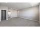 Carpeted main bedroom with closet and entry into bathroom at 8629 Ensworth St # 113, Las Vegas, NV 89123