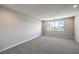 Spacious carpeted bedroom with a large window providing natural light at 8629 Ensworth St # 113, Las Vegas, NV 89123