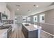 Kitchen with quartz countertops, gas range, stainless appliances, and island sink at 8629 Ensworth St # 113, Las Vegas, NV 89123