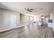 Open-concept living space with modern kitchen and staircase leading to the upper floor at 8629 Ensworth St # 113, Las Vegas, NV 89123