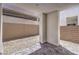 Modern patio area featuring stone landscaping and a sleek architectural design at 8629 Ensworth St # 113, Las Vegas, NV 89123