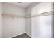A walk-in closet featuring wood supports for hanging and carpeted flooring at 8629 Ensworth St # 113, Las Vegas, NV 89123