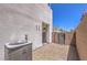 A low-maintenance backyard features decorative rocks, an AC unit and two metal gates at 8629 Ensworth St # 114, Las Vegas, NV 89123