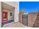 Features a low-maintenance backyard area with decorative rocks, and a gate, perfect for modern living at 8629 Ensworth St # 114, Las Vegas, NV 89123