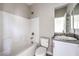 Well-lit bathroom featuring a tub/shower combination, toilet, and single sink vanity with modern finishes at 8629 Ensworth St # 114, Las Vegas, NV 89123