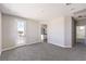 Spacious carpeted bedroom with an outside balcony and adjoining bathroom at 8629 Ensworth St # 114, Las Vegas, NV 89123
