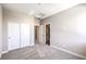 Bedroom featuring neutral carpeting, paint, closet, and an ensuite bathroom at 8629 Ensworth St # 114, Las Vegas, NV 89123