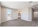 Bedroom with neutral carpet, and a door leading to a balcony at 8629 Ensworth St # 114, Las Vegas, NV 89123