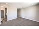 Spacious bedroom featuring neutral carpeting, paint, and an ensuite bathroom at 8629 Ensworth St # 114, Las Vegas, NV 89123