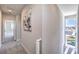 Second floor hallway features natural lighting, neutral wall paint, and carpet flooring at 8629 Ensworth St # 114, Las Vegas, NV 89123