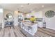 Bright kitchen with island, breakfast bar seating, stainless steel appliances, and modern cabinetry at 8629 Ensworth St # 114, Las Vegas, NV 89123