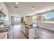 Bright, open kitchen flows seamlessly into the living area, boasting ample natural light and contemporary finishes at 8629 Ensworth St # 114, Las Vegas, NV 89123