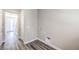 Neutral toned laundry room features gray vinyl floors, utility hookups, and ample space at 8629 Ensworth St # 114, Las Vegas, NV 89123