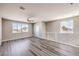 Open upstairs living space with a modern railing, fan, and ample natural light at 8629 Ensworth St # 114, Las Vegas, NV 89123