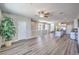 Spacious living area showcases an open-concept layout with hardwood floors, flowing into the modern kitchen area at 8629 Ensworth St # 114, Las Vegas, NV 89123