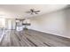 Expansive open-concept living space with a modern kitchen, dining, and living area at 8629 Ensworth St # 114, Las Vegas, NV 89123