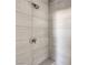 Close-up of the modern shower with gray tile and chrome fixtures at 8629 Ensworth St # 114, Las Vegas, NV 89123