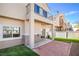 View of backyard with patio, artificial turf, and covered overhang for relaxing outside at 8798 Tom Noon Ave # 103, Las Vegas, NV 89178