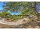 Picturesque community park featuring walking path, lush grass, picnic bench, and mature trees at 8798 Tom Noon Ave # 103, Las Vegas, NV 89178
