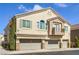 Attractive townhome showcasing a three-car garage, and a charming, covered balcony at 8798 Tom Noon Ave # 103, Las Vegas, NV 89178