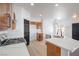 Spacious kitchen with white countertops, wooden cabinets, and stainless steel appliances at 8798 Tom Noon Ave # 103, Las Vegas, NV 89178