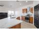 Well-equipped kitchen with a stainless steel stove, range hood, and custom wooden cabinets at 8798 Tom Noon Ave # 103, Las Vegas, NV 89178