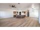 Expansive open-concept living and kitchen area with modern lighting and stylish flooring at 8798 Tom Noon Ave # 103, Las Vegas, NV 89178