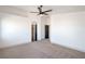 Spacious main bedroom with a ceiling fan and access to an ensuite bathroom at 8798 Tom Noon Ave # 103, Las Vegas, NV 89178
